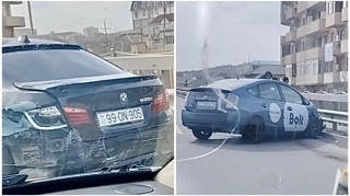 Qayda pozan “Prius” sürücüsü “BMW”ni vurub dəmir səddə çırpıldı   - VİDEO