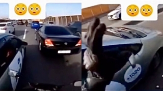 Motosikletçi onu ötməyə qoymayan “Prius”un güzgüsünü sındırdı - VİDEO