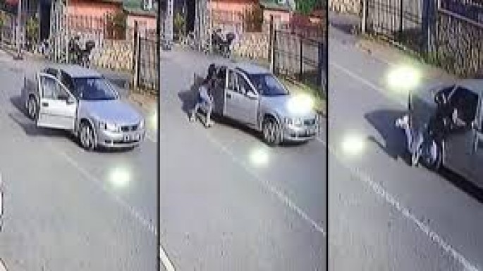 Sürücü dalaşdığı qadını avtomobildən yerə atdı - VİDEO