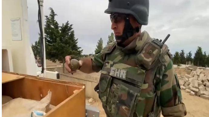 Bakıda qəbiristanlıqda tapança və qumbara tapılıb - VİDEO 