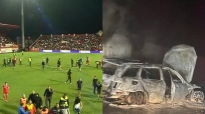 Futbol matçında azarkeşlər meydana girib, referinin avtomobili yandırılıb - VİDEO - FOTO