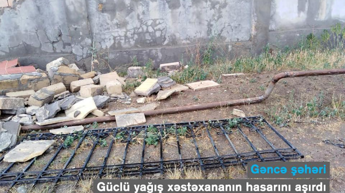Gəncədə xəstəxananın hasarı uçdu, qaz xətti yararsız hala düşdü - FOTO