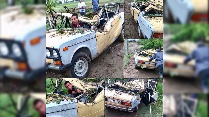 Güclü külək ağacı “VAZ-2106”nın üzərinə aşırdı  - VİDEO