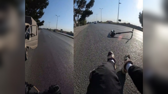 Əks yolla gələn skuter sürücüsü maşının qapısına çırpılıb yerə yıxıldı - VİDEO