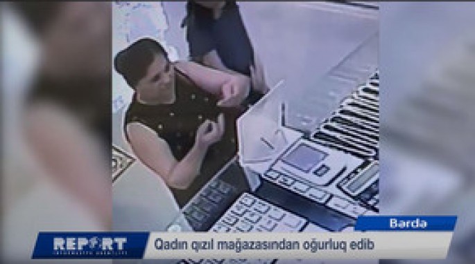 Oğurluq edən qadın təhlükəsizlik kamerasına düşüb - VİDEO