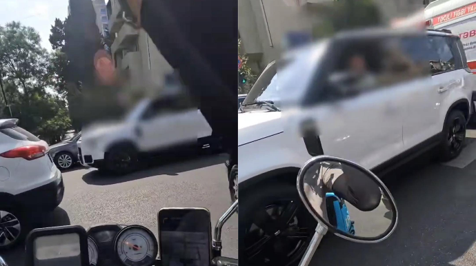 “Range Rover” sürücüsü kəsişmədə yolu bağlayıb motokuryerlə mübahisə etdi - VİDEO 