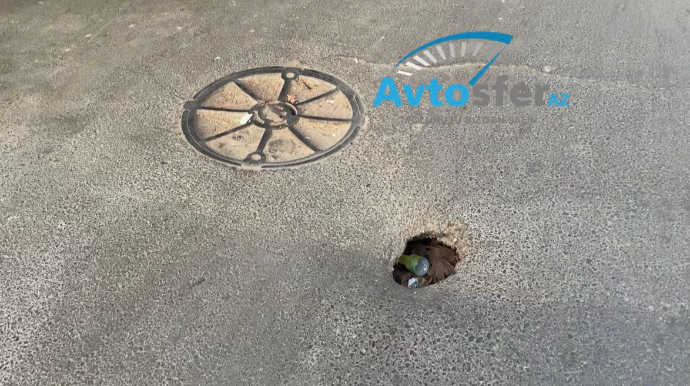 Nəsimi rayonunda təhlükəli yol: Asfalt çöküb, quyu yaranıb  - VİDEO