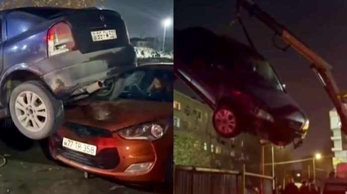 Sumqayıtda qəribə qəza: “Opel” avtoyuma məntəqəsindəki maşının üzərinə çıxdı - VİDEO