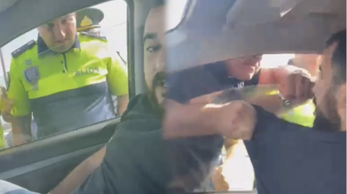 Yol polisi ilə mübahisə edən sürücü həbs edildi  - VİDEO