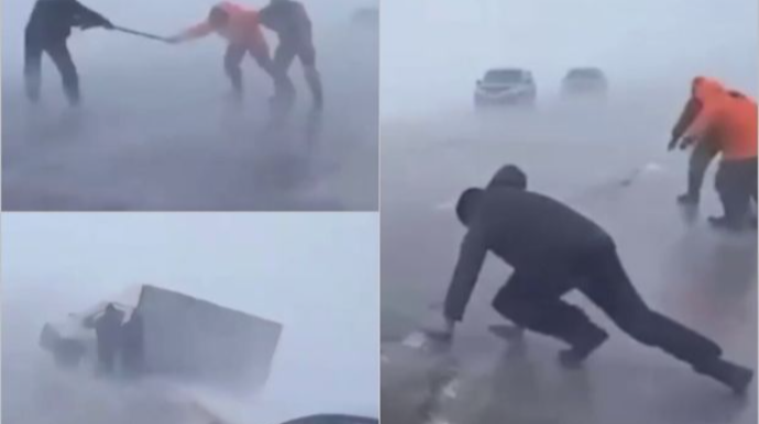Rusiyada güclü külək maşınları xəndəyə atdı, insanlar sürünərək yolu keçdi  - VİDEO
