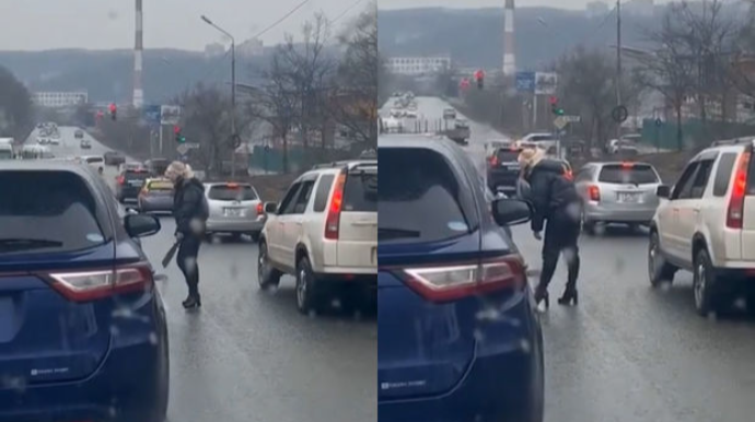 Rusiyada əlində maçete olan qadın avtomobilə hücum etdi - VİDEO 