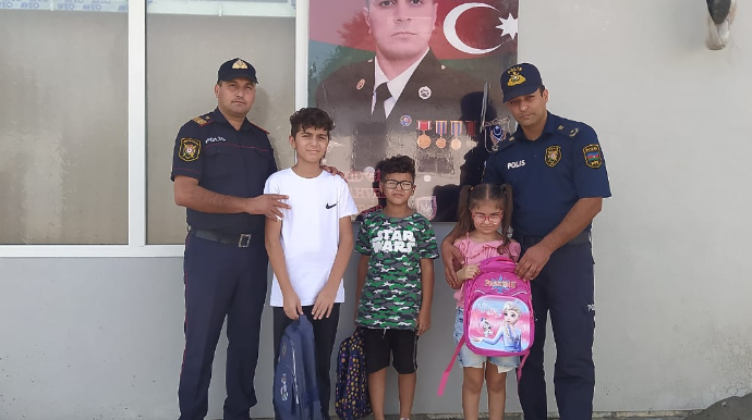 Ucarda polis əməkdaşları şəhid övladlarını yeni dərs ilinin başlanması münasibətilə təbrik etdilər - FOTO