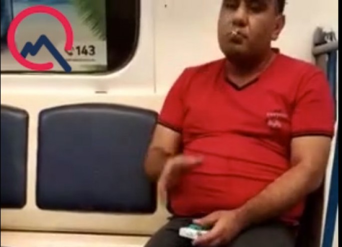 Bakı metrosunda biabırçılıq - Qatarda siqaret çəkdi - VİDEO