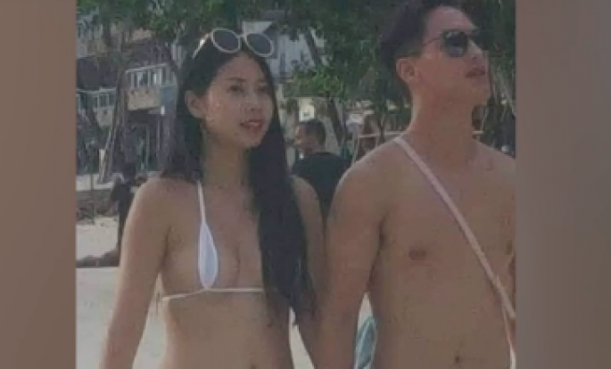 Turist qız erotik bikinisinə görə cərimələndi - VİDEO