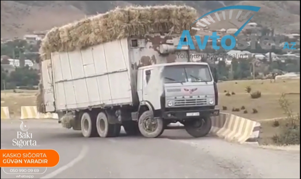 "Kamaz"a artıq yük vuran sürücü yoxuşda dönə bilməyib yolu kəsdi - VİDEO