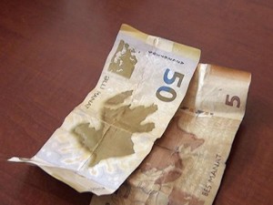 Saxta pulla alış-veriş edənlər tutuldu