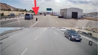 Təmir sexindən yola düşən təkər  sürücülərə təhlükəli anlar yaşatdı  - VİDEO