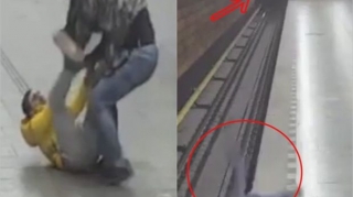 Dalaşdığı oğlanı gələn qatarın atına atdı - ANBAAN VİDEO 