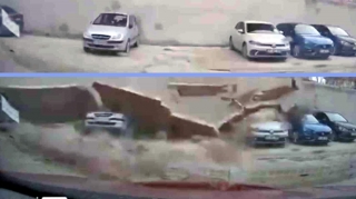 Güclü külək damın kərpic divarını maşınların üstünə aşırdı: 6-sı əzildi - VİDEO 