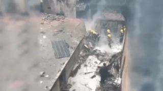 Çində təyyarə evlərin üzərinə düşüb: Ölənlər var 