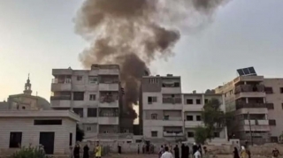 Suriyada hərbi helikopter  yaşayış binalarının üzərinə düşüb