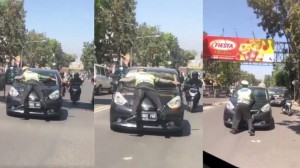 Qayda pozan sürücü yol polisini kapotun üstündə "sürüdü" - VİDEO