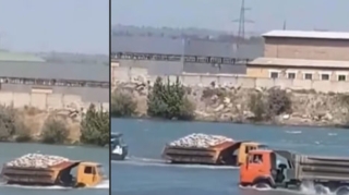 Не машина, а вездеход:  в Сальянском районе КАМАЗы "проплыли" по реке - ВИДЕО 