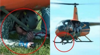 “Like”  toplamaq üçün kişini helikopterin gövdəsinə bağlayaraq havaya qaldırdı  - VİDEO