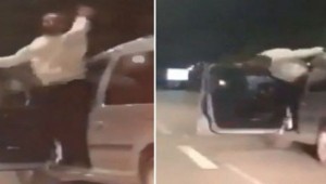 Sürücü hərəkətdə olan avtomobilin qapısını açıb oynadı - VİDEO