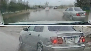 Yağışlı havada sağdan ötmə edən sürücü təhlükə saçdı   - VİDEO