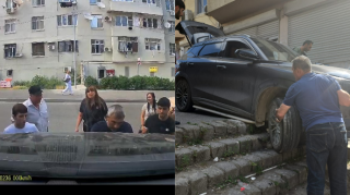 Pilləkəndən düşən maşını qadın çiyni ilə çıxardı – BAKIDA – VİDEO 