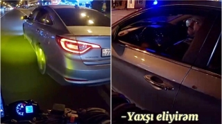 Bakıda sürücü motosikletə təhlükə yaradıb sürücü “əcəb edirəm”  dedi  - VİDEO