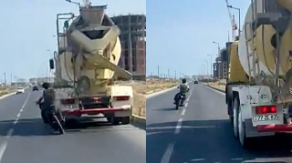 Hövsanda motosiklet sürücüsündən “ölüm şousu”:  Az qala yük maşınına çırpılacaqdı  - VİDEO
